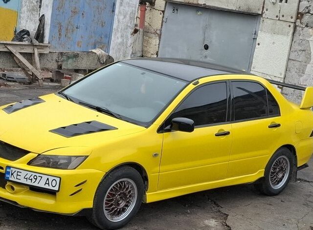 Жовтий Міцубісі Lancer, об'ємом двигуна 1.3 л та пробігом 380 тис. км за 3500 $, фото 12 на Automoto.ua