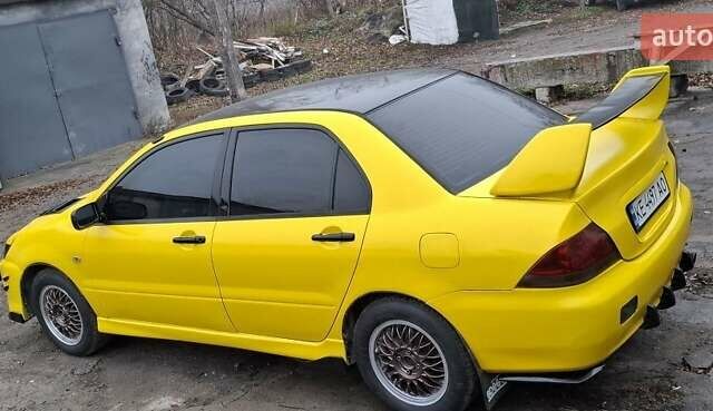 Желтый Мицубиси Лансер, объемом двигателя 1.3 л и пробегом 380 тыс. км за 3500 $, фото 12 на Automoto.ua