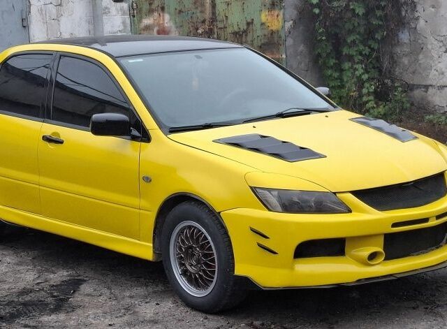 Жовтий Міцубісі Lancer, об'ємом двигуна 1.3 л та пробігом 380 тис. км за 3500 $, фото 16 на Automoto.ua