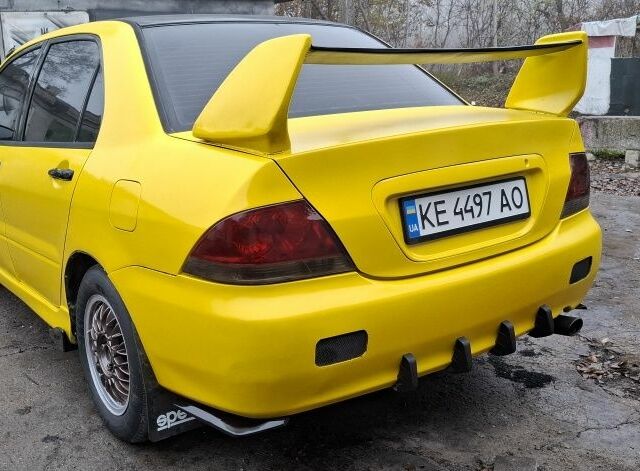 Жовтий Міцубісі Lancer, об'ємом двигуна 1.3 л та пробігом 380 тис. км за 3500 $, фото 19 на Automoto.ua