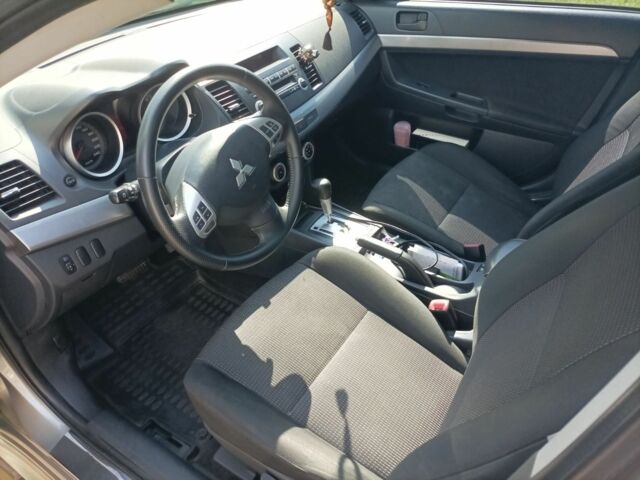 Желтый Мицубиси Лансер, объемом двигателя 2 л и пробегом 137 тыс. км за 7300 $, фото 8 на Automoto.ua