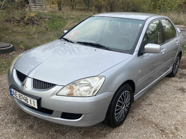 Серый Мицубиси Лансер, объемом двигателя 1.6 л и пробегом 289 тыс. км за 3150 $, фото 7 на Automoto.ua