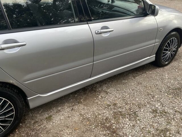 Серый Мицубиси Лансер, объемом двигателя 1.6 л и пробегом 289 тыс. км за 3150 $, фото 4 на Automoto.ua