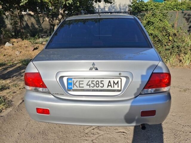 Серый Мицубиси Лансер, объемом двигателя 1.6 л и пробегом 98 тыс. км за 4800 $, фото 7 на Automoto.ua