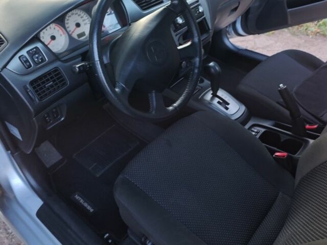 Серый Мицубиси Лансер, объемом двигателя 1.6 л и пробегом 98 тыс. км за 4800 $, фото 2 на Automoto.ua