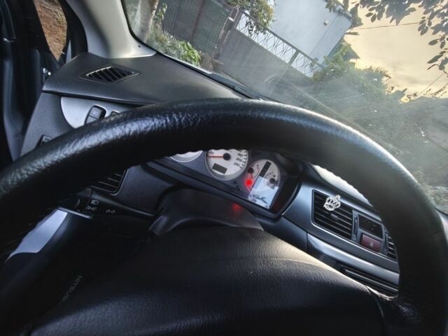 Серый Мицубиси Лансер, объемом двигателя 1.6 л и пробегом 98 тыс. км за 4800 $, фото 4 на Automoto.ua