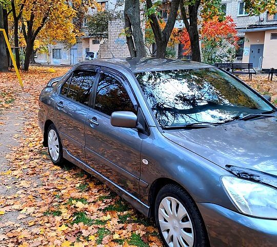 Сірий Міцубісі Lancer, об'ємом двигуна 1.6 л та пробігом 206 тис. км за 3300 $, фото 1 на Automoto.ua