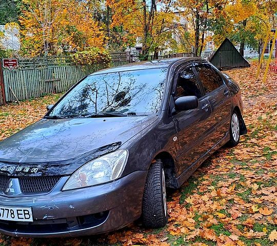 Сірий Міцубісі Lancer, об'ємом двигуна 1.6 л та пробігом 206 тис. км за 3300 $, фото 7 на Automoto.ua