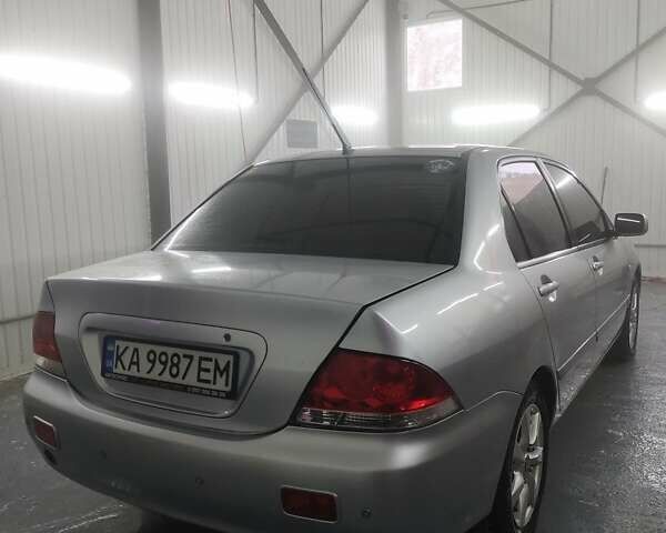 Серый Мицубиси Лансер, объемом двигателя 1.6 л и пробегом 330 тыс. км за 3900 $, фото 2 на Automoto.ua