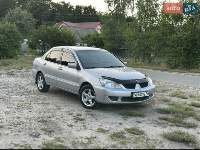 Серый Мицубиси Лансер, объемом двигателя 1.6 л и пробегом 197 тыс. км за 4200 $, фото 7 на Automoto.ua