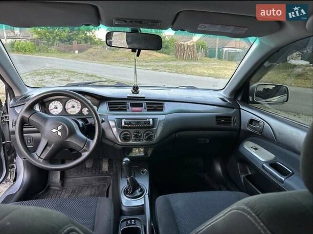 Серый Мицубиси Лансер, объемом двигателя 1.6 л и пробегом 197 тыс. км за 4200 $, фото 5 на Automoto.ua