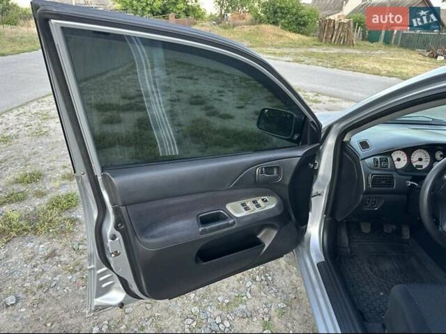 Серый Мицубиси Лансер, объемом двигателя 1.6 л и пробегом 197 тыс. км за 4200 $, фото 3 на Automoto.ua