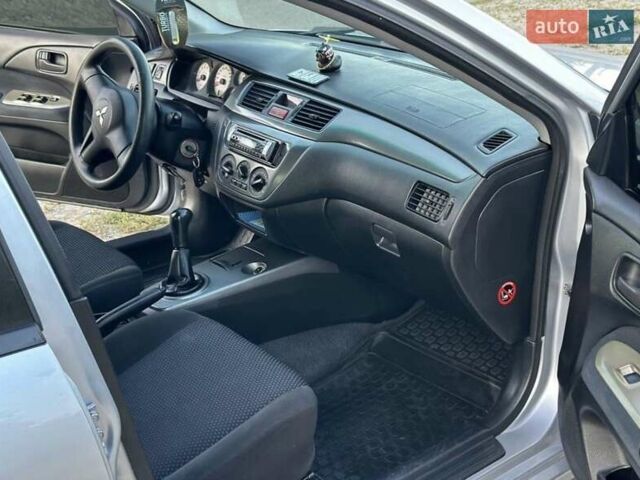 Серый Мицубиси Лансер, объемом двигателя 1.6 л и пробегом 197 тыс. км за 4200 $, фото 6 на Automoto.ua