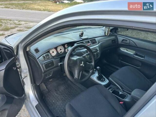 Серый Мицубиси Лансер, объемом двигателя 1.6 л и пробегом 197 тыс. км за 4200 $, фото 4 на Automoto.ua