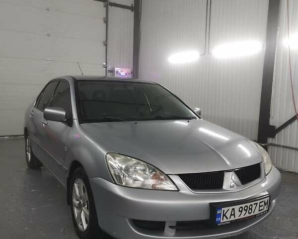 Серый Мицубиси Лансер, объемом двигателя 1.6 л и пробегом 330 тыс. км за 3900 $, фото 1 на Automoto.ua