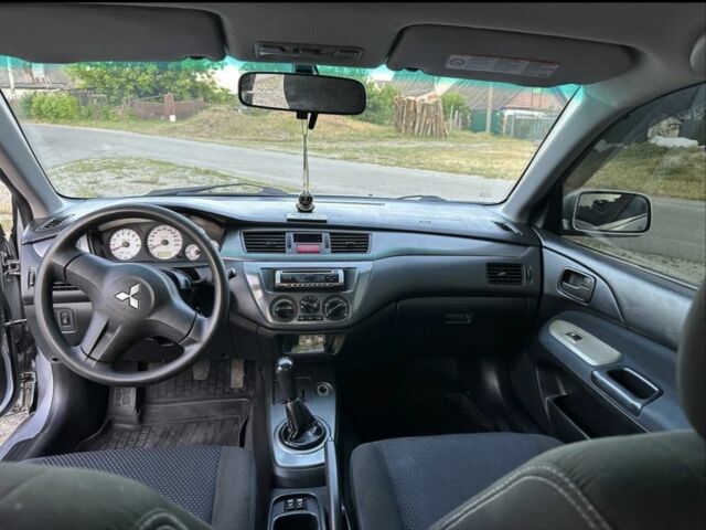 Серый Мицубиси Лансер, объемом двигателя 1.6 л и пробегом 197 тыс. км за 4200 $, фото 6 на Automoto.ua