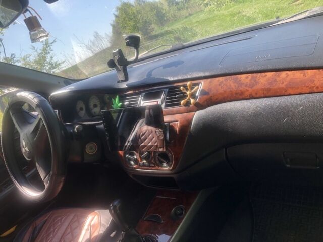 Серый Мицубиси Лансер, объемом двигателя 1.6 л и пробегом 318 тыс. км за 3350 $, фото 3 на Automoto.ua