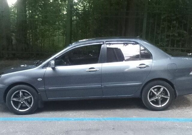 Серый Мицубиси Лансер, объемом двигателя 1.6 л и пробегом 318 тыс. км за 3350 $, фото 9 на Automoto.ua