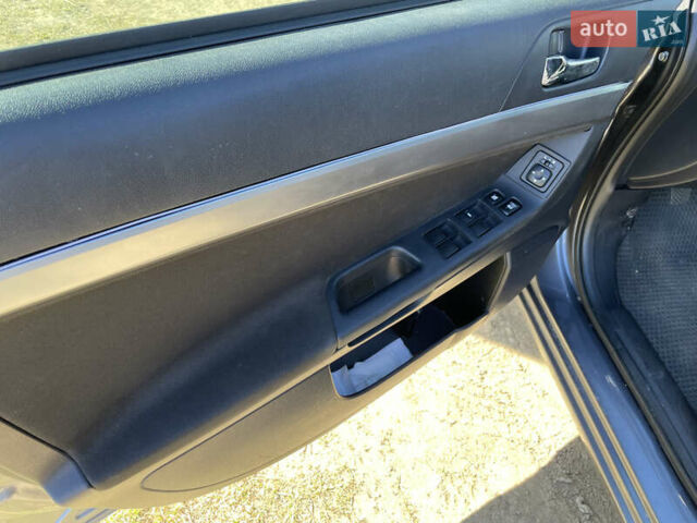 Серый Мицубиси Лансер, объемом двигателя 1.5 л и пробегом 139 тыс. км за 6600 $, фото 18 на Automoto.ua