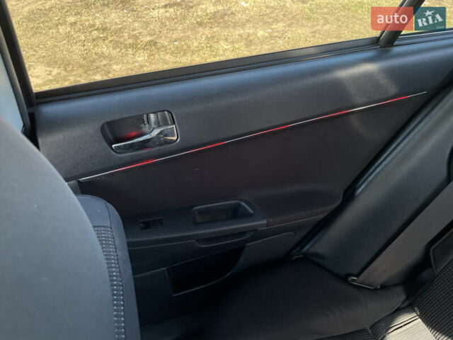 Серый Мицубиси Лансер, объемом двигателя 1.5 л и пробегом 139 тыс. км за 6600 $, фото 19 на Automoto.ua