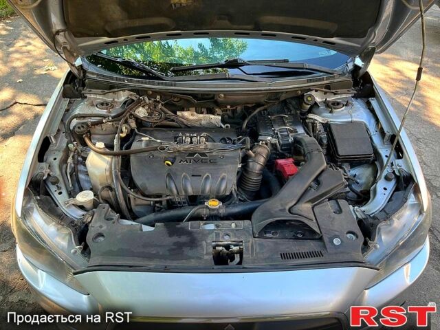 Серый Мицубиси Лансер, объемом двигателя 1.8 л и пробегом 246 тыс. км за 5600 $, фото 11 на Automoto.ua