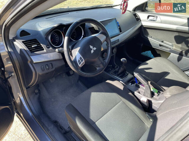 Серый Мицубиси Лансер, объемом двигателя 1.5 л и пробегом 139 тыс. км за 6600 $, фото 12 на Automoto.ua