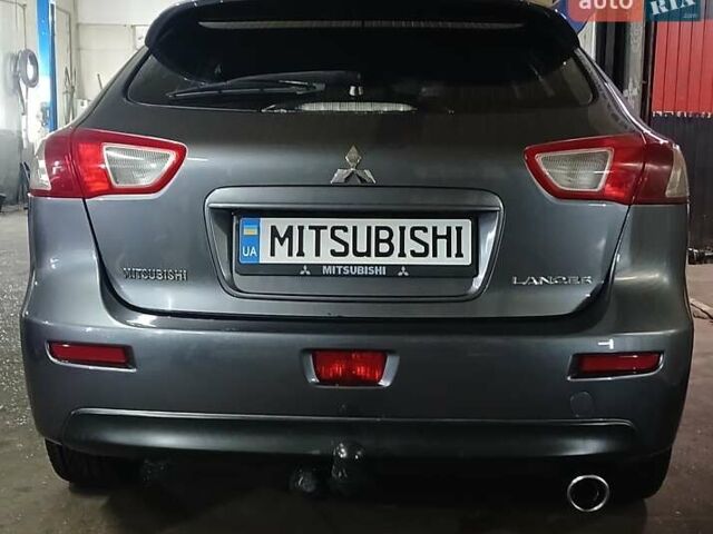 Серый Мицубиси Лансер, объемом двигателя 1.8 л и пробегом 165 тыс. км за 7700 $, фото 7 на Automoto.ua