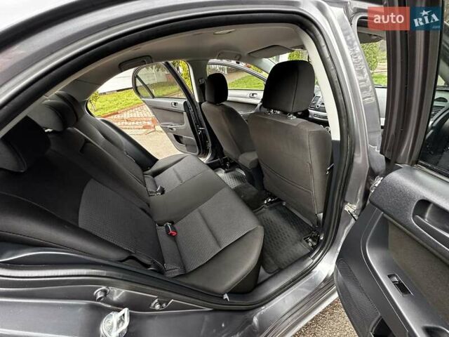 Серый Мицубиси Лансер, объемом двигателя 1.8 л и пробегом 44 тыс. км за 6499 $, фото 27 на Automoto.ua