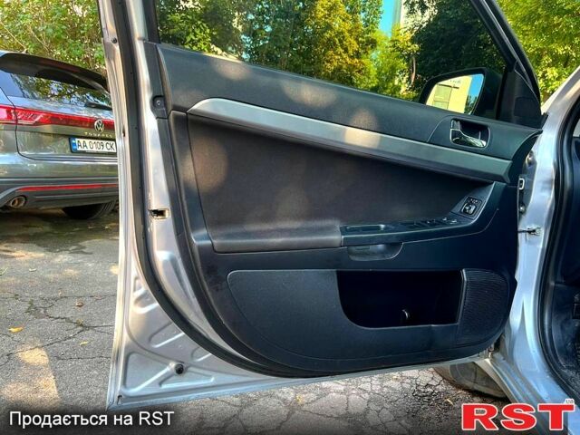 Серый Мицубиси Лансер, объемом двигателя 1.8 л и пробегом 246 тыс. км за 5600 $, фото 9 на Automoto.ua