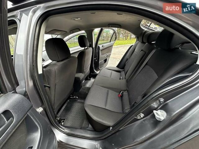 Серый Мицубиси Лансер, объемом двигателя 1.8 л и пробегом 44 тыс. км за 6499 $, фото 25 на Automoto.ua