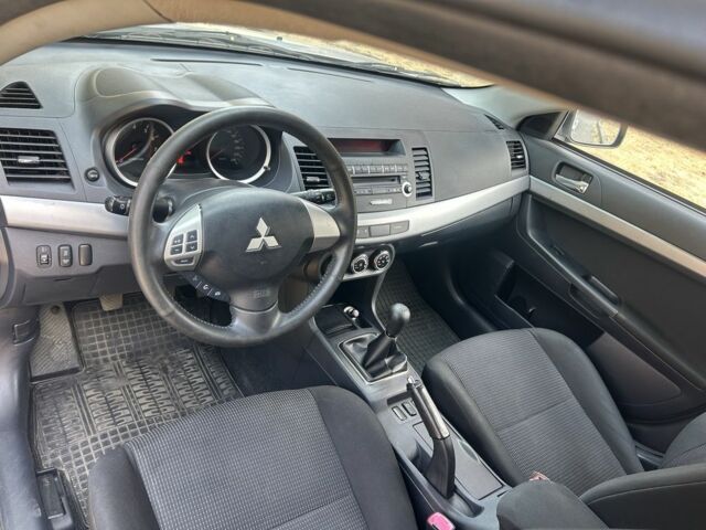 Серый Мицубиси Лансер, объемом двигателя 1.6 л и пробегом 94 тыс. км за 7999 $, фото 7 на Automoto.ua