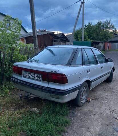 Сірий Міцубісі Lancer, об'ємом двигуна 1.5 л та пробігом 678 тис. км за 474 $, фото 1 на Automoto.ua