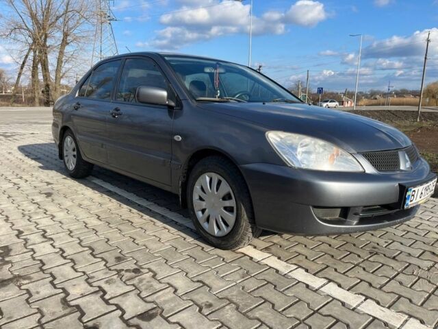 Сірий Міцубісі Lancer, об'ємом двигуна 1.6 л та пробігом 255 тис. км за 4200 $, фото 3 на Automoto.ua