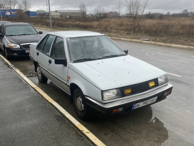 Сірий Міцубісі Lancer, об'ємом двигуна 0.13 л та пробігом 220 тис. км за 500 $, фото 1 на Automoto.ua