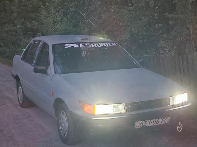 Серый Мицубиси Лансер, объемом двигателя 1.5 л и пробегом 450 тыс. км за 550 $, фото 2 на Automoto.ua