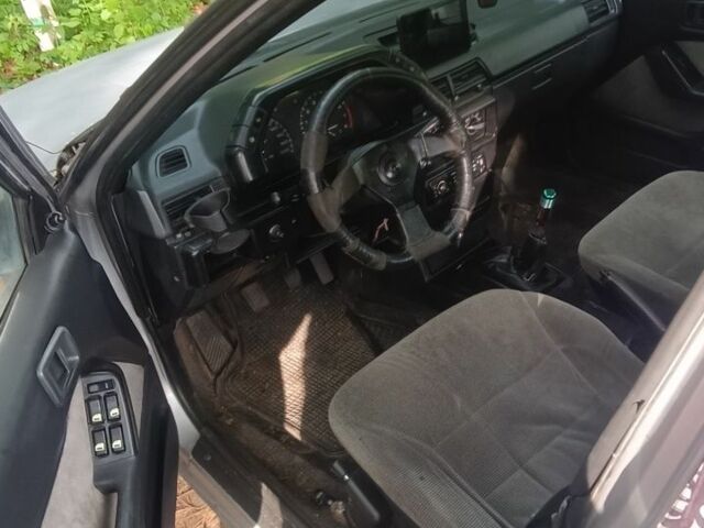 Серый Мицубиси Лансер, объемом двигателя 1.5 л и пробегом 450 тыс. км за 550 $, фото 6 на Automoto.ua