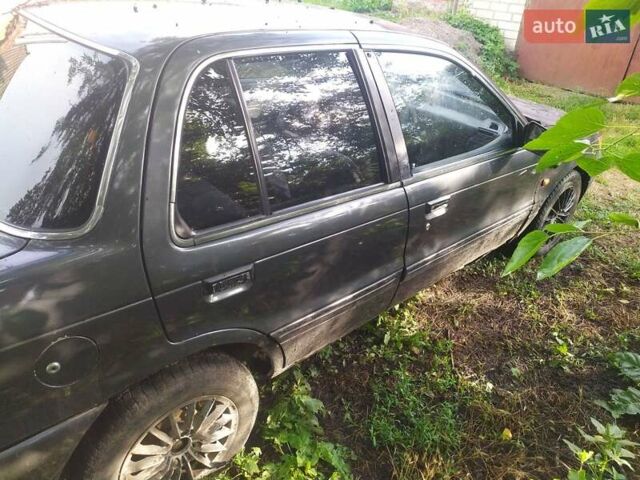 Сірий Міцубісі Lancer, об'ємом двигуна 1.5 л та пробігом 250 тис. км за 1000 $, фото 2 на Automoto.ua