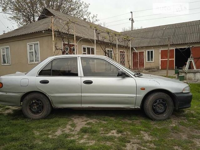 Сірий Міцубісі Lancer, об'ємом двигуна 1.3 л та пробігом 277 тис. км за 1300 $, фото 1 на Automoto.ua