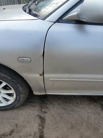 Серый Мицубиси Лансер, объемом двигателя 1.6 л и пробегом 334 тыс. км за 2200 $, фото 9 на Automoto.ua