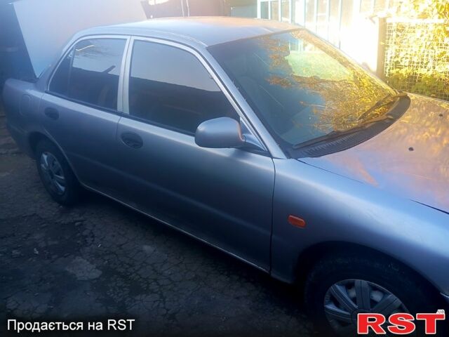 Сірий Міцубісі Lancer, об'ємом двигуна 1.3 л та пробігом 0 тис. км за 1200 $, фото 2 на Automoto.ua