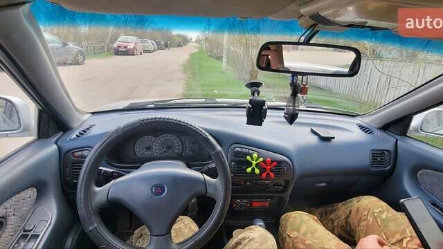 Серый Мицубиси Лансер, объемом двигателя 1.6 л и пробегом 334 тыс. км за 2200 $, фото 11 на Automoto.ua