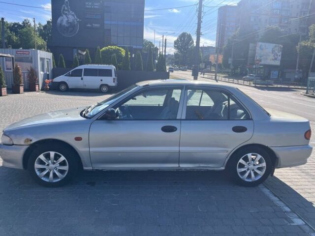 Сірий Міцубісі Lancer, об'ємом двигуна 1.3 л та пробігом 331 тис. км за 800 $, фото 6 на Automoto.ua