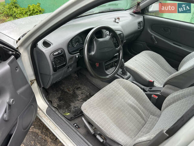 Серый Мицубиси Лансер, объемом двигателя 1.3 л и пробегом 218 тыс. км за 1000 $, фото 4 на Automoto.ua