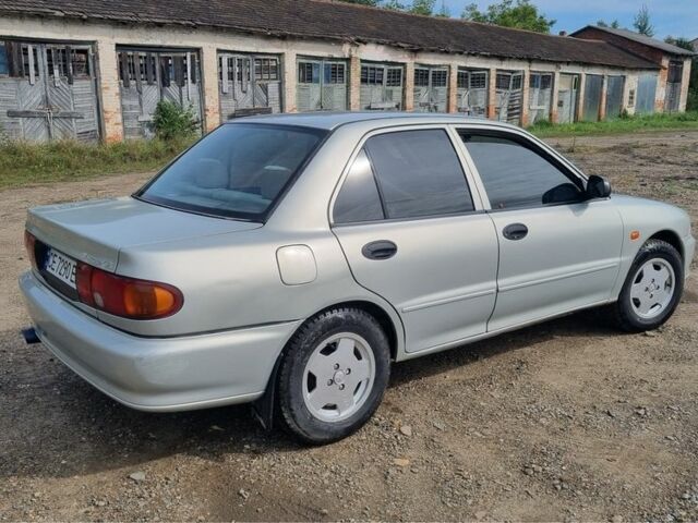 Сірий Міцубісі Lancer, об'ємом двигуна 1.3 л та пробігом 1 тис. км за 2000 $, фото 2 на Automoto.ua