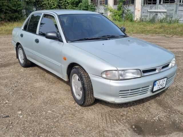 Сірий Міцубісі Lancer, об'ємом двигуна 1.3 л та пробігом 1 тис. км за 2000 $, фото 1 на Automoto.ua