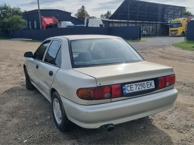 Сірий Міцубісі Lancer, об'ємом двигуна 1.3 л та пробігом 1 тис. км за 2000 $, фото 4 на Automoto.ua