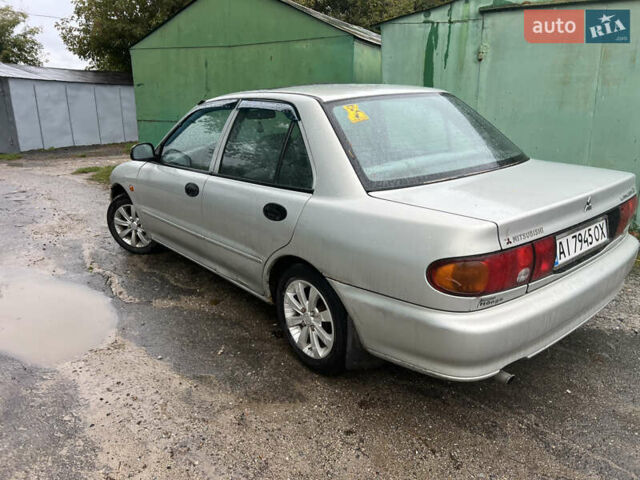 Серый Мицубиси Лансер, объемом двигателя 1.3 л и пробегом 217 тыс. км за 1000 $, фото 3 на Automoto.ua