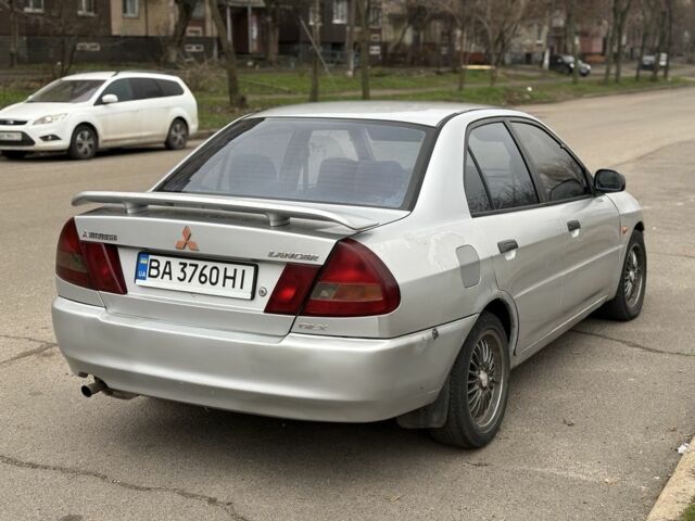 Сірий Міцубісі Lancer, об'ємом двигуна 1.3 л та пробігом 200 тис. км за 1100 $, фото 2 на Automoto.ua