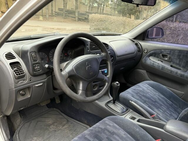 Серый Мицубиси Лансер, объемом двигателя 1.3 л и пробегом 320 тыс. км за 1450 $, фото 11 на Automoto.ua