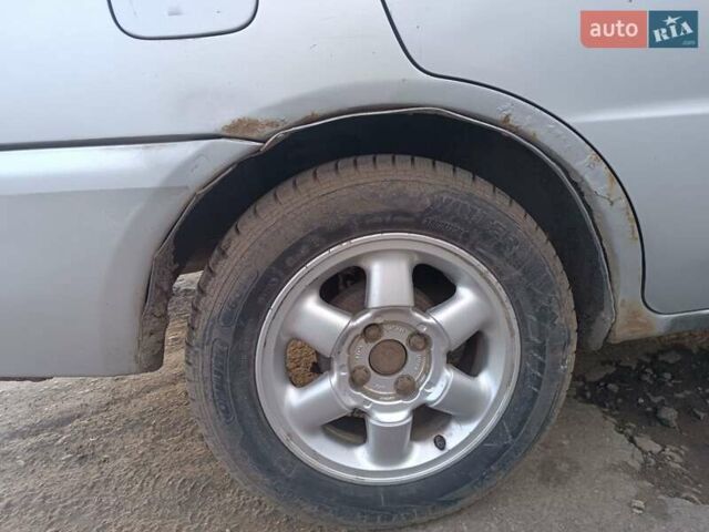 Серый Мицубиси Лансер, объемом двигателя 1.3 л и пробегом 390 тыс. км за 1800 $, фото 45 на Automoto.ua